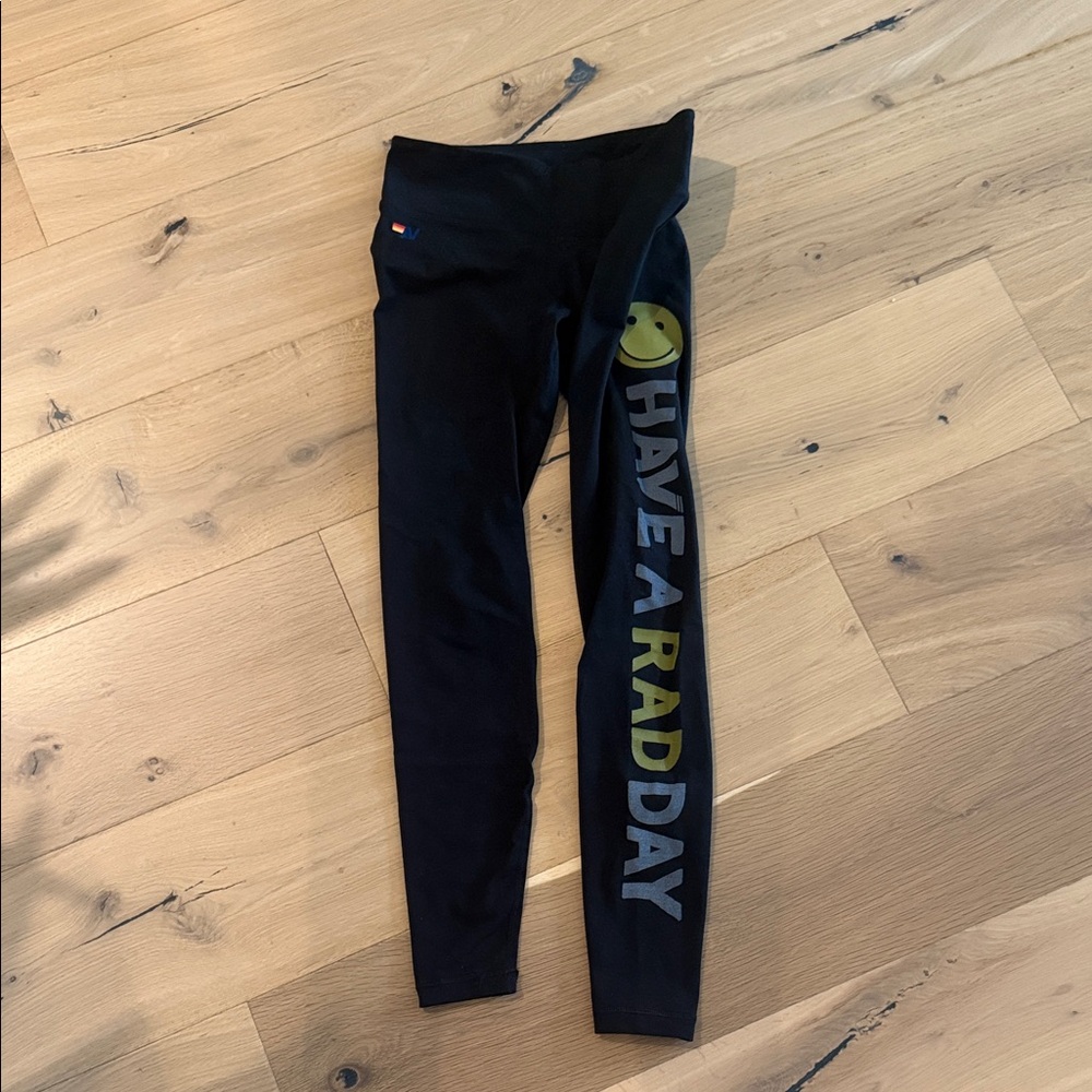 Aviator nation Black Leggings with Graphic Print “have a rad day”.